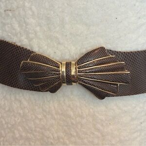 Judith Leiber adjustable leather belt with gold detailed clap.